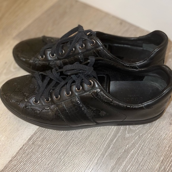 Black Gucci shoes.